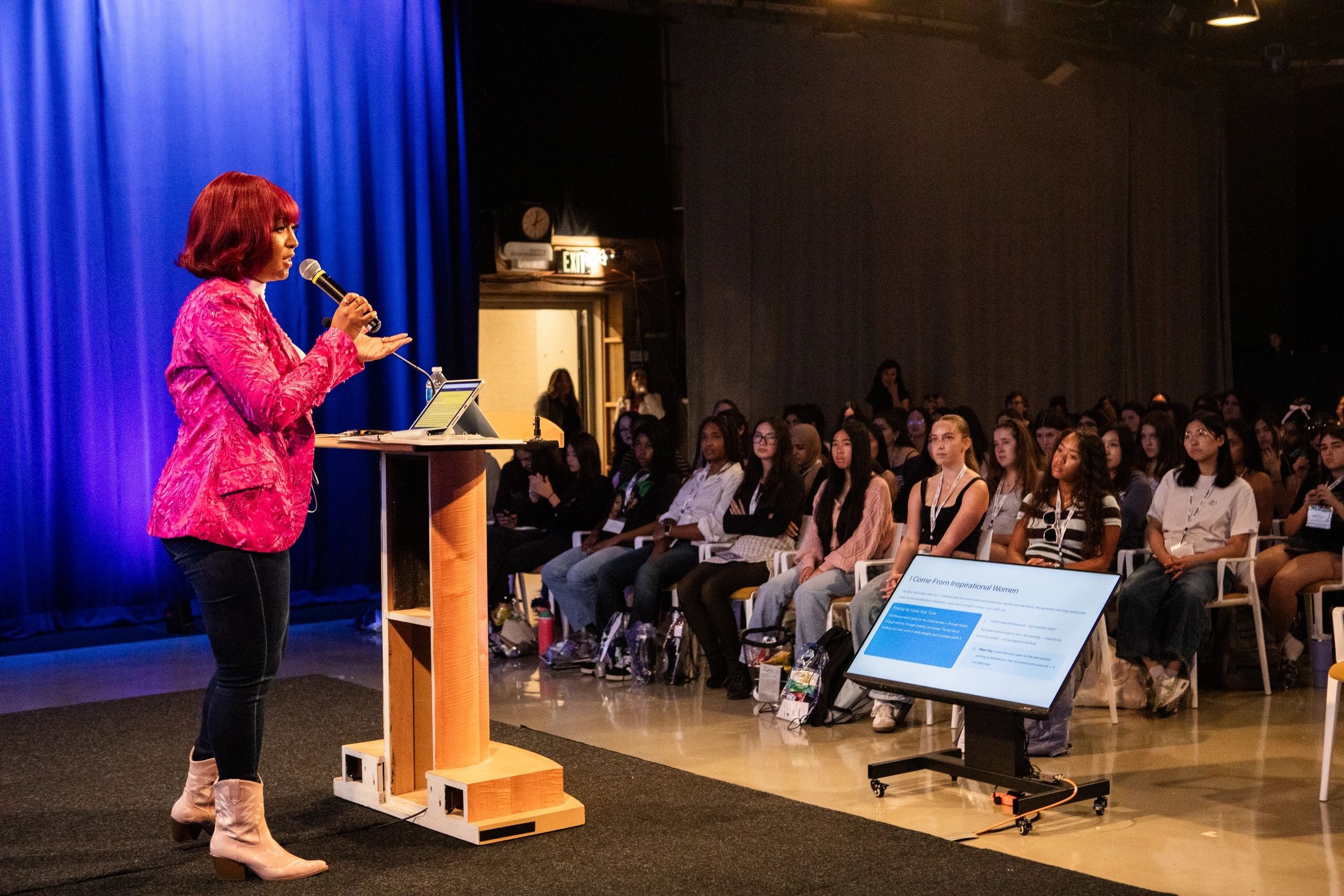 Angie T speaking at an event
